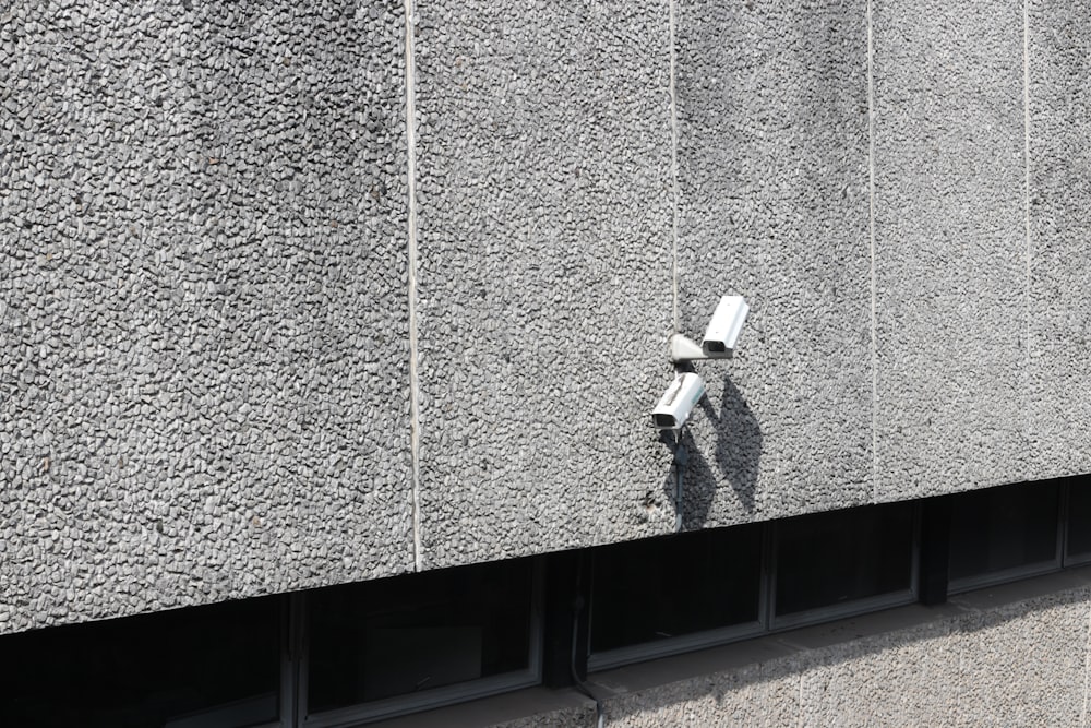 bullet security camera on concrete wall