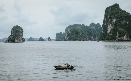 person boating on sea in Công Viên Hoa Hạ Long Vietnam