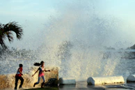 A candid moment of children playing by the waterfront, their laughter almost audible.