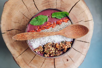 Close-up of a trending nutrient-rich superfood blend in a rustic bowl with fresh herbs around
