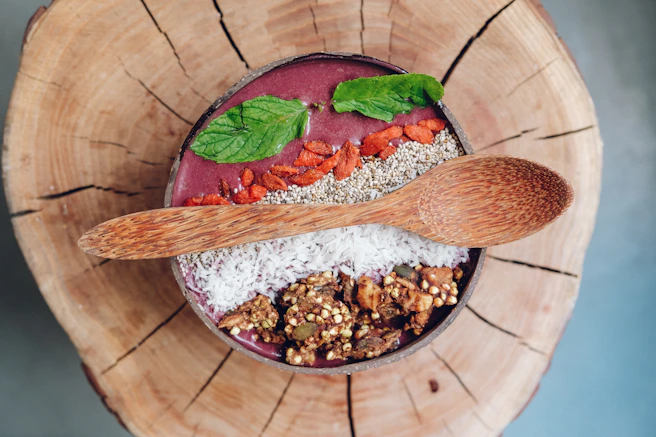 Close-up of a trending nutrient-rich superfood blend in a rustic bowl with fresh herbs around