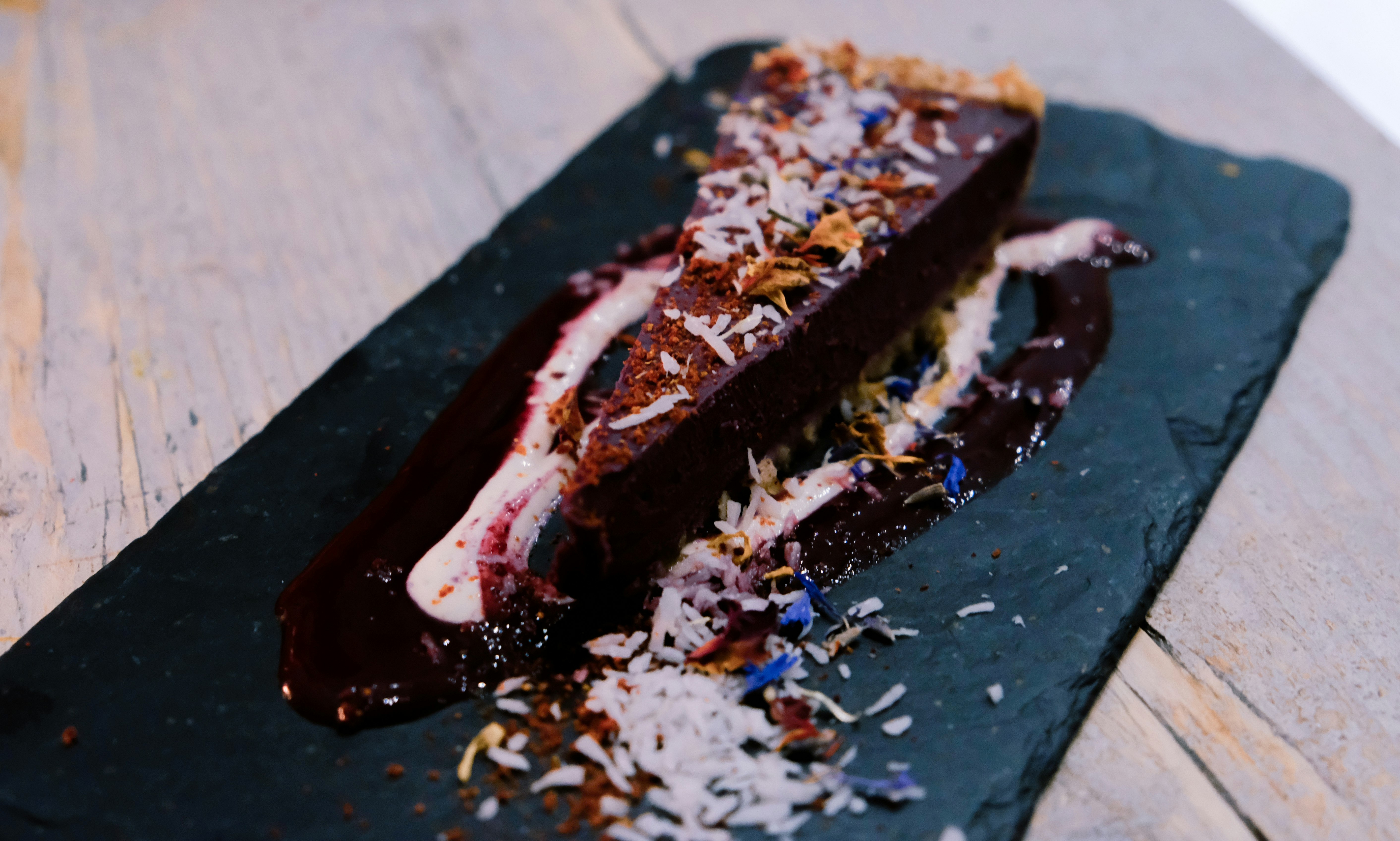 sliced chocolate cake with flakes