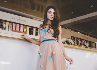 woman wearing peach-colored maxi dress