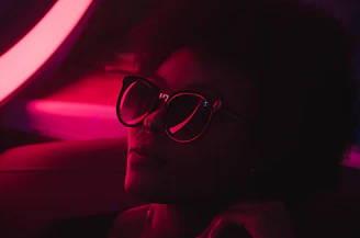A high-fashion editorial shot featuring dramatic shadows and a neon lime-green backdrop.