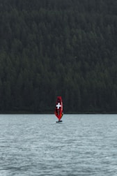 a boat with a cross on it is in the water