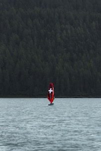 a boat with a cross on it is in the water