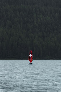 a boat with a cross on it is in the water