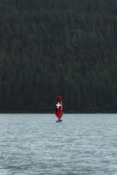a boat with a cross on it is in the water