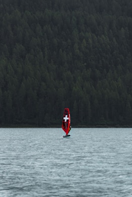 a boat with a cross on it is in the water