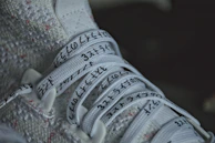 Close-up of a classic white sneaker with clean, crisp white laces perfectly tied