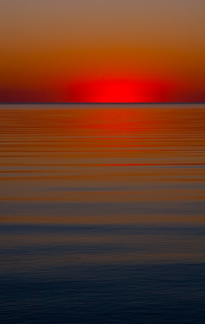 sunset over the ocean waterts