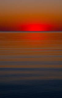 sunset over the ocean waterts