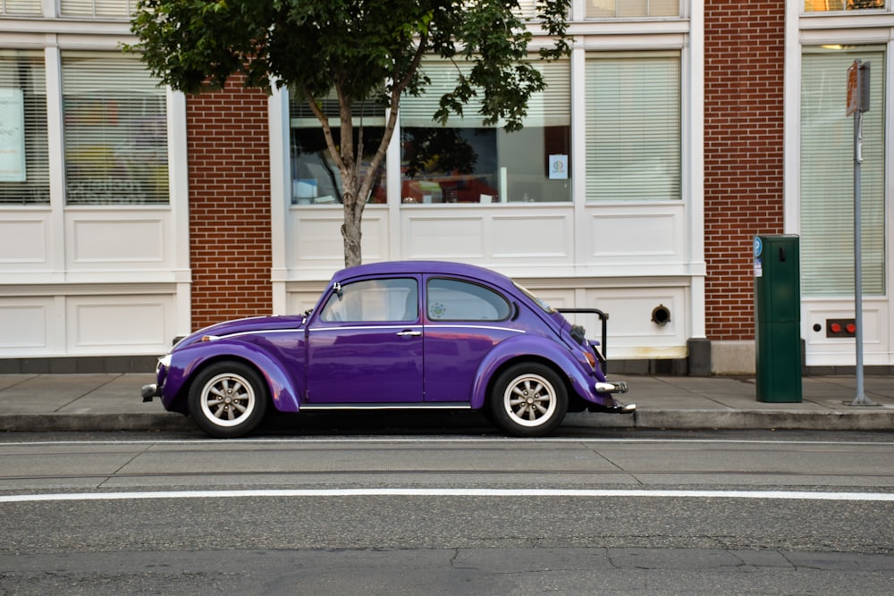 purple 3-door hatchback parked on street