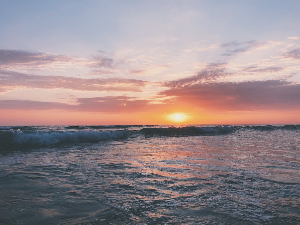 body of water at golden hour