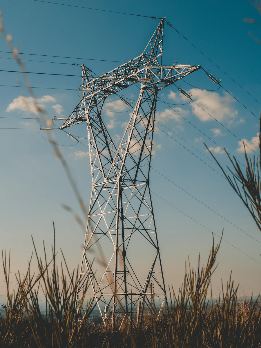 High-voltage transmission tower and conductors against the sky