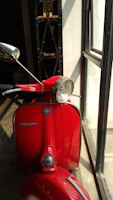 A vibrant retro Vespa wallpaper featuring classic design elements.