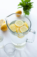 slices of lemons in clear pitcher filled with water