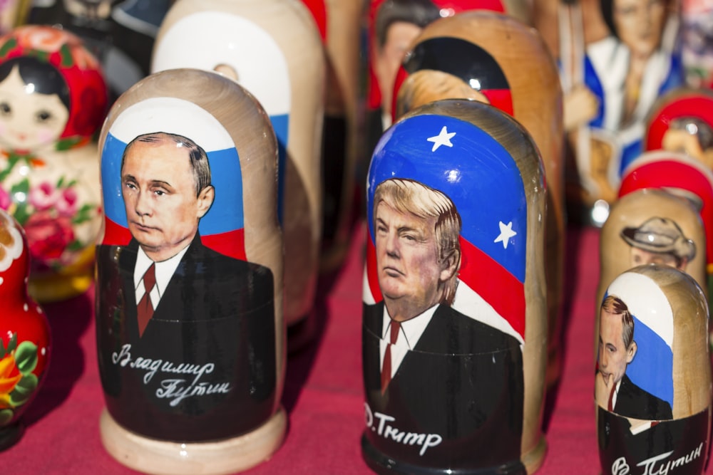 Donald Trump nesting dolls on red textile