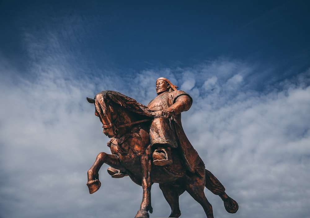 male riding horse statue