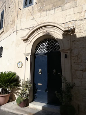 A stylish entryway featuring a double door with elegant handles.