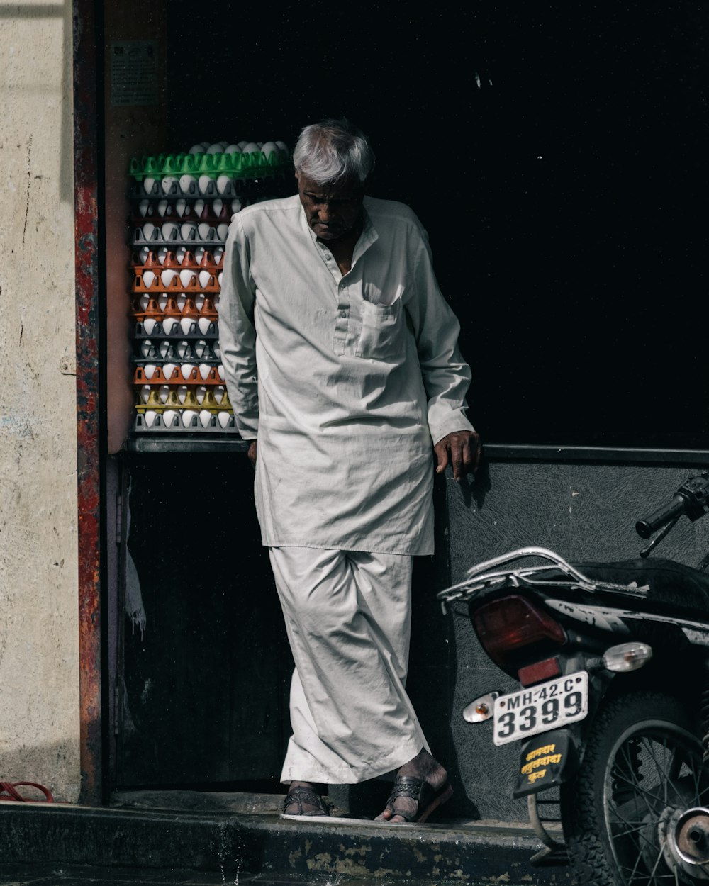 man standing near motorcycle