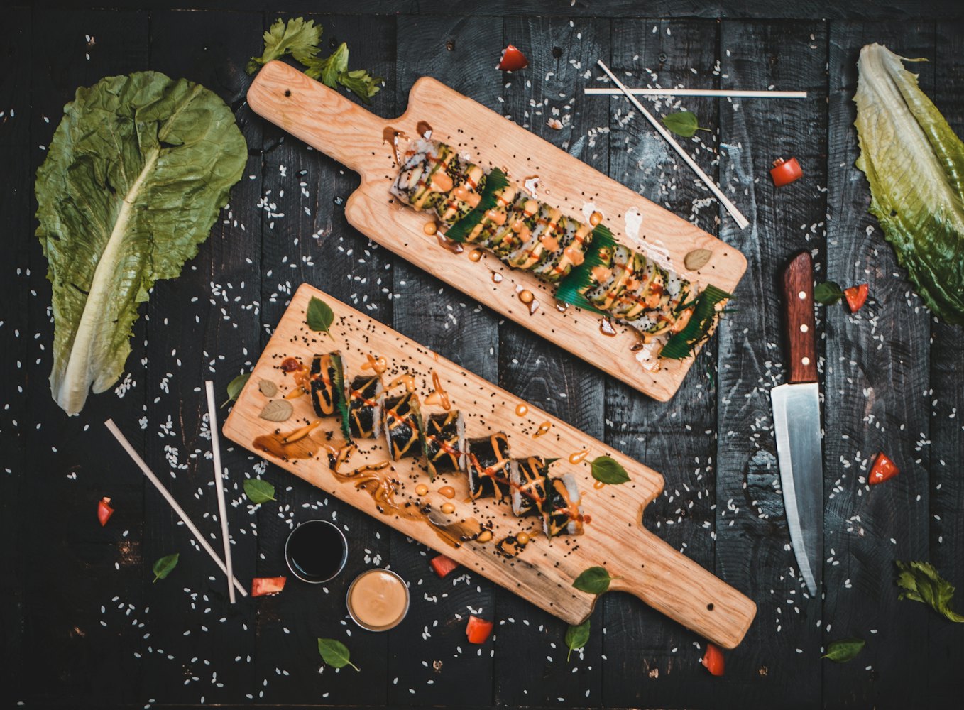 Sushi selection on a slate board over crushed ice in cold light — stock photograph, not Opoke!’s raw bar