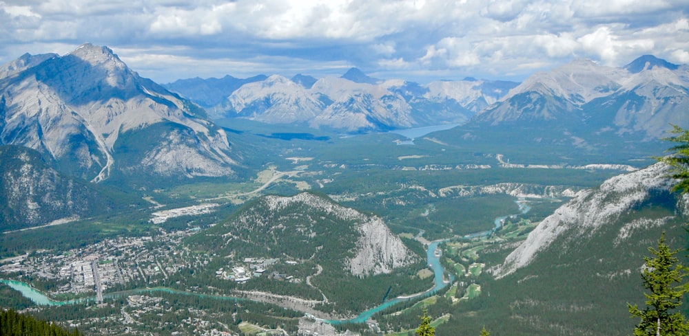 aerial view of town surrounded by mountain ranges