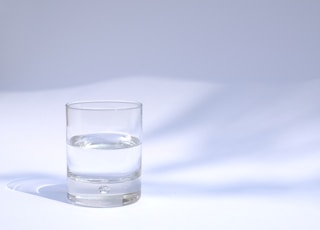 clear drinking glass filled with water