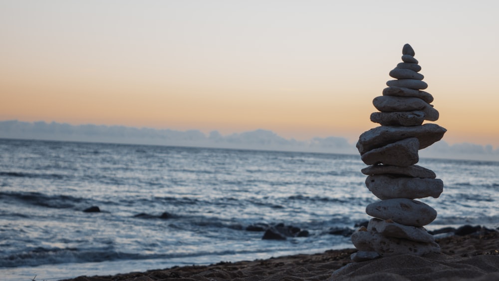 pile of white rocks on the seashore