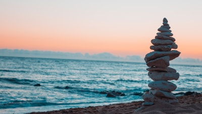 pile of white rocks on the seashore peaceful zoom background