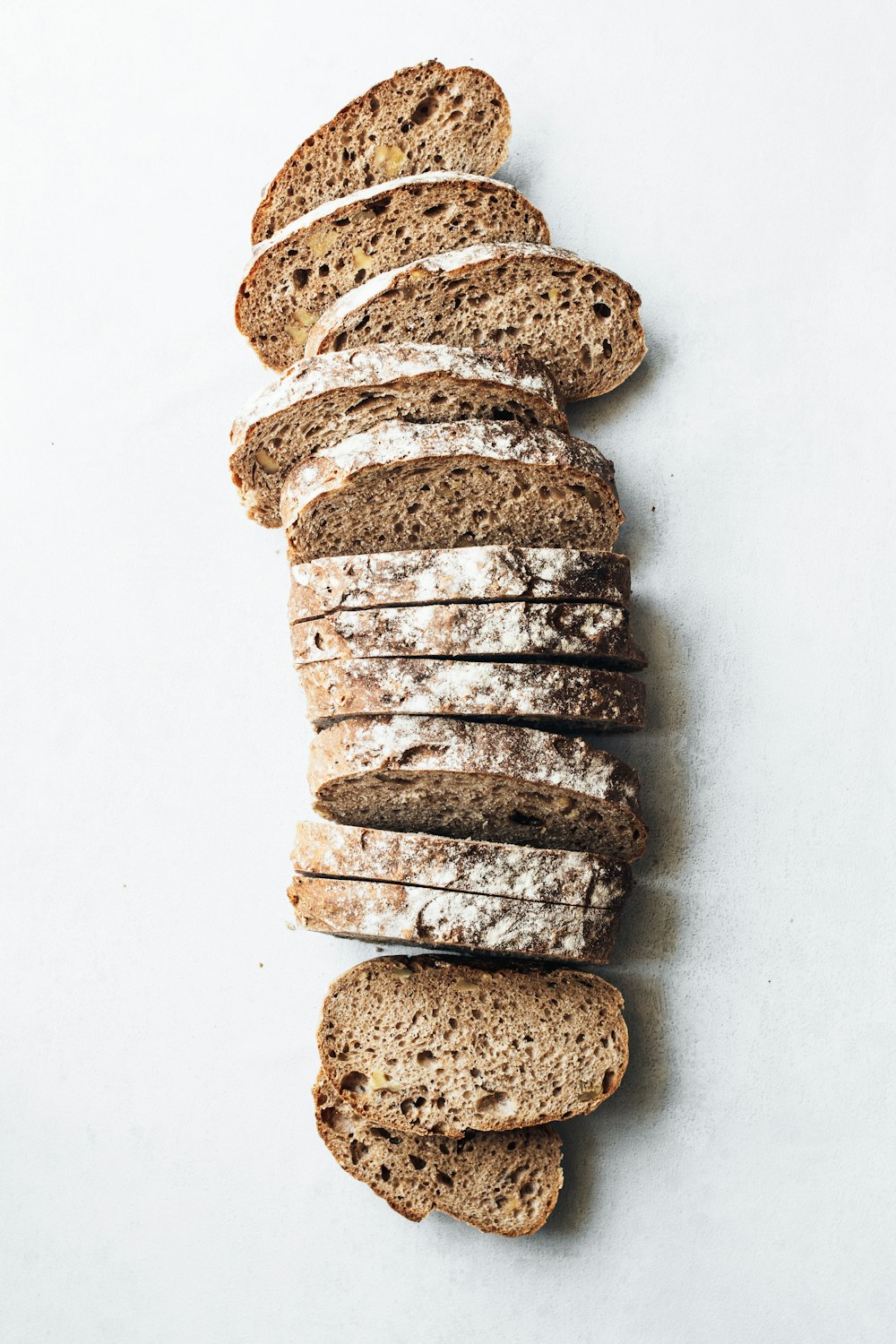 sliced breads on white surface