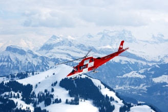 photo of flight of red and white rescue helicopter during snow daytime