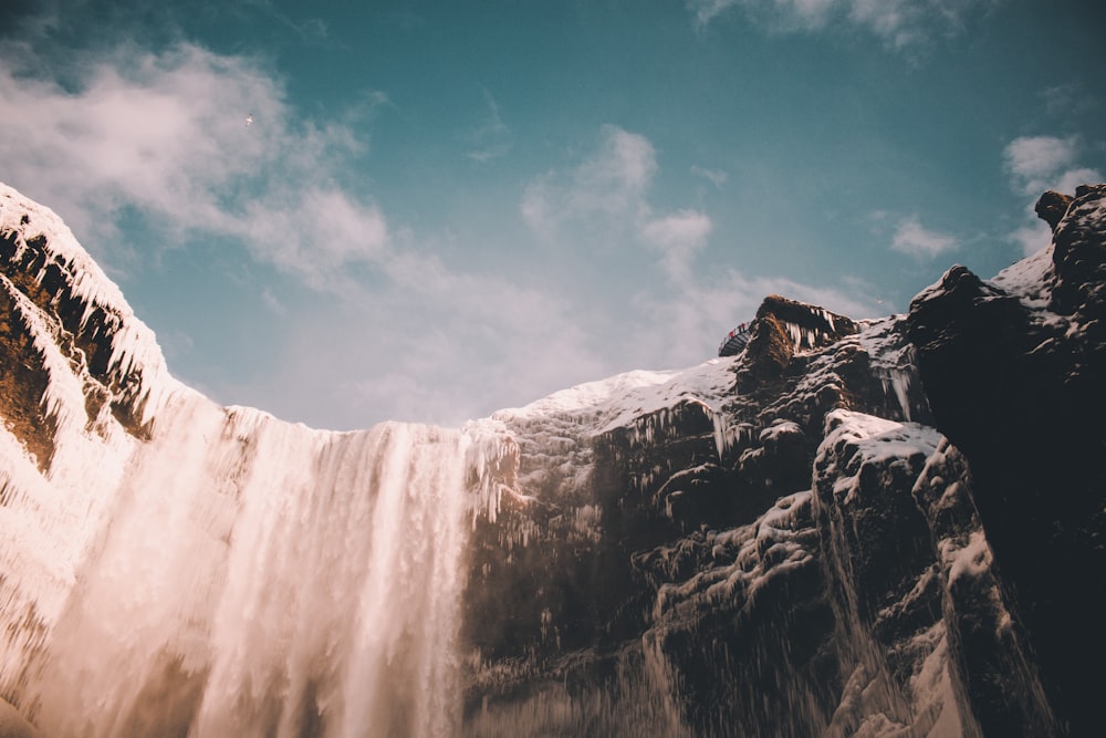 low angle photo of waterfalls at daytime