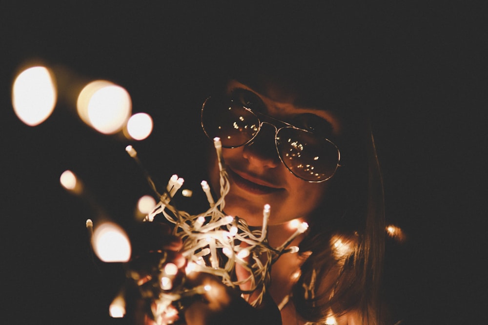 woman wearing brown aviator sunglasses in shallow focus photography