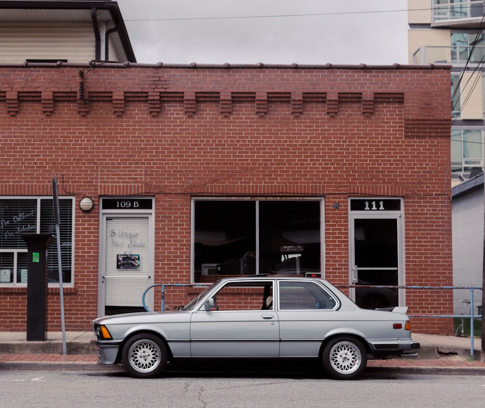 gray sedan on road