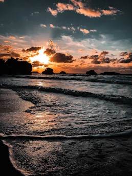 sunlight covering clouds over sea
