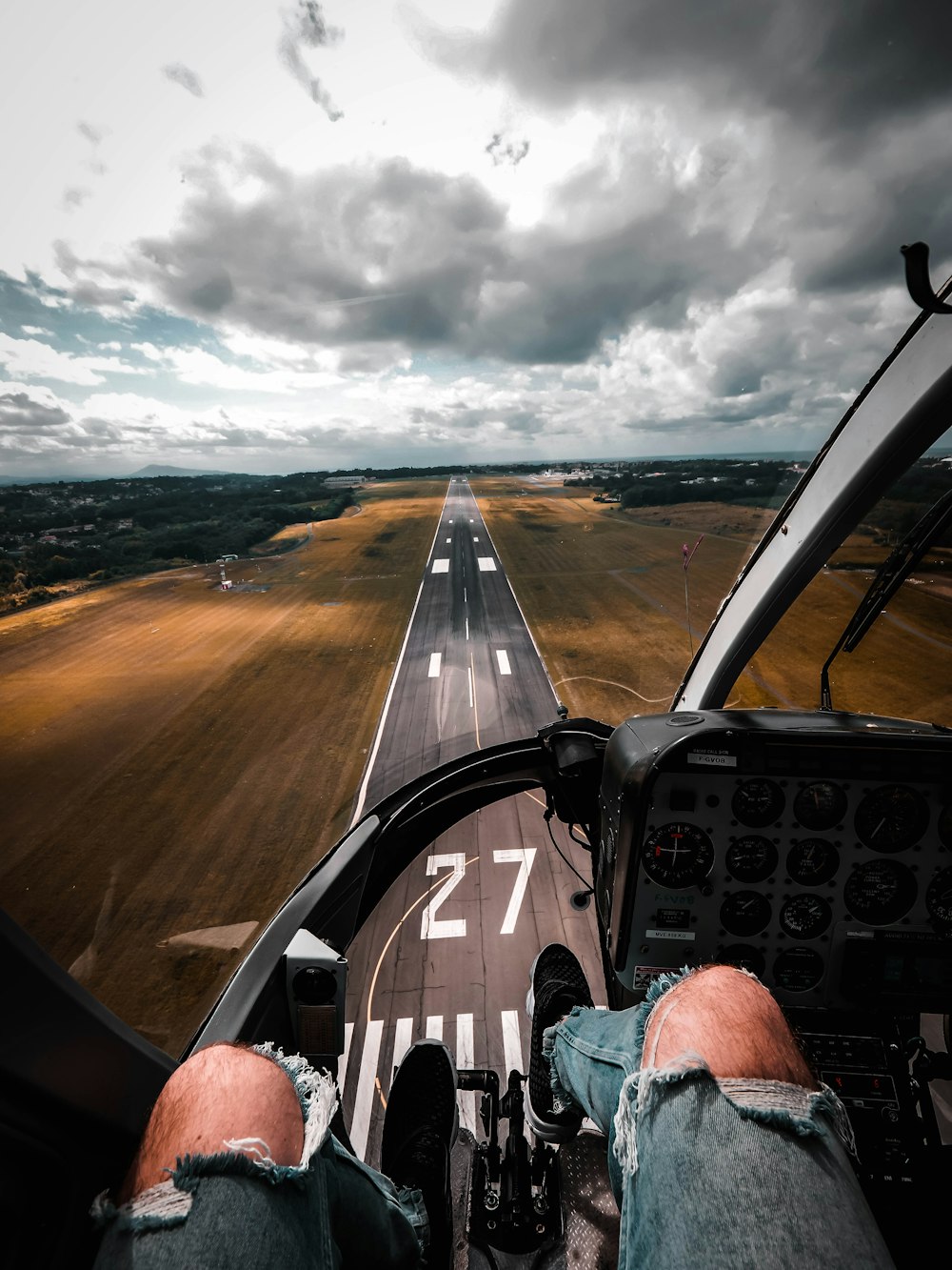 person sitting on plane dashboard