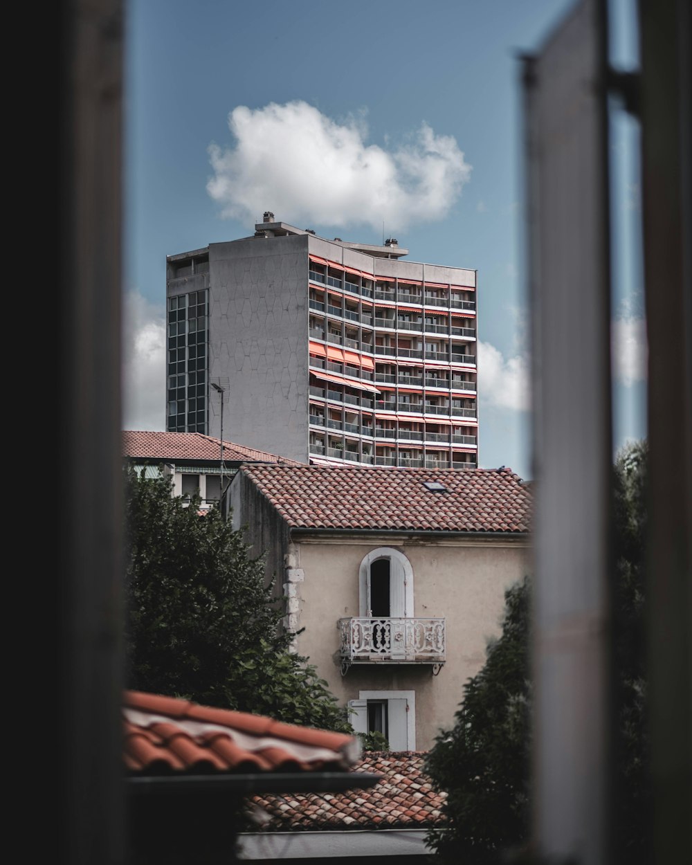 gray and red concrete building during daytime