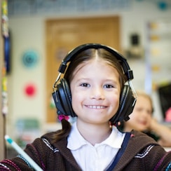 girl wearing black headphones