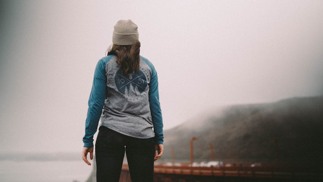 woman standing on docking pier