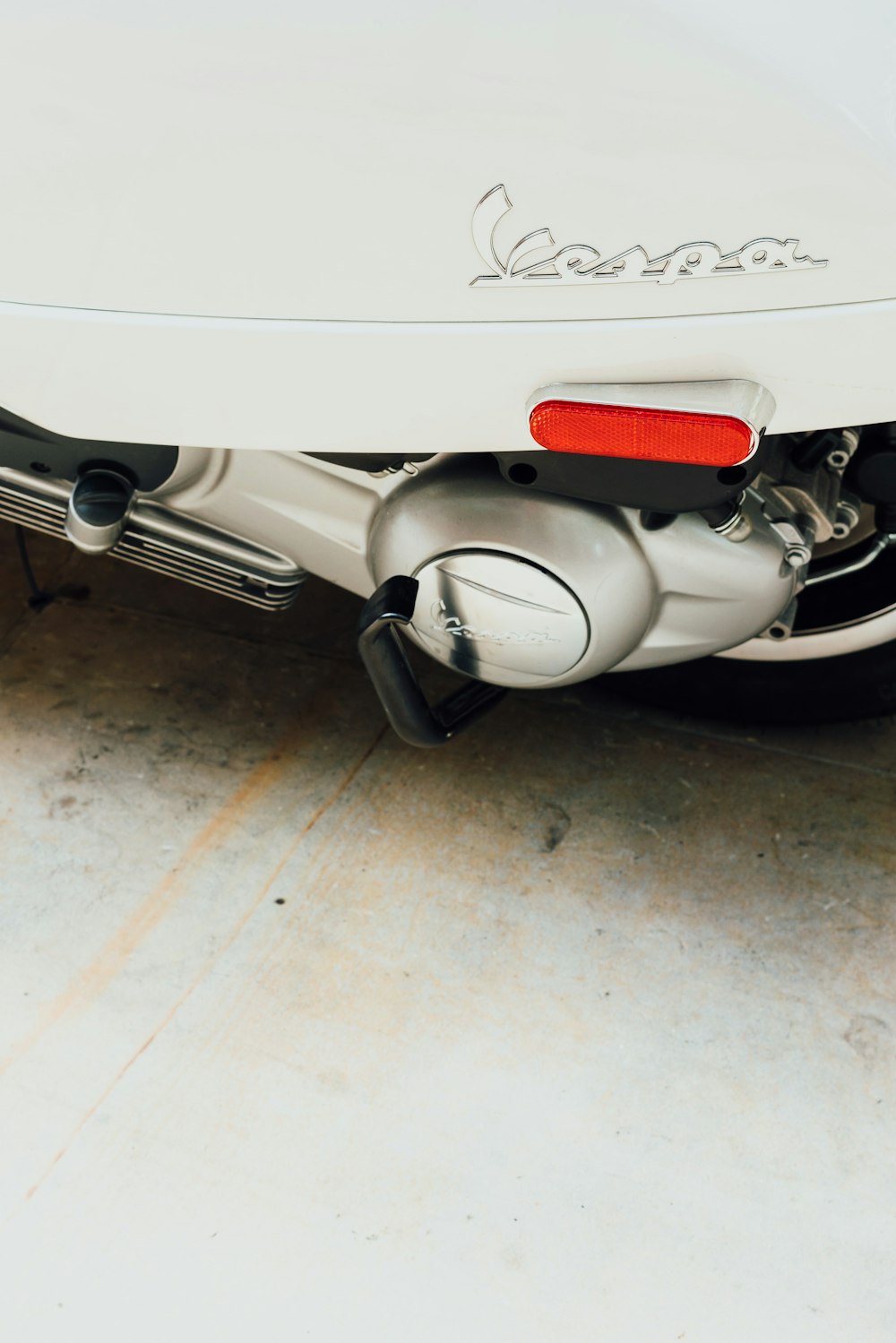 closeup photo of Vespa motorcycle