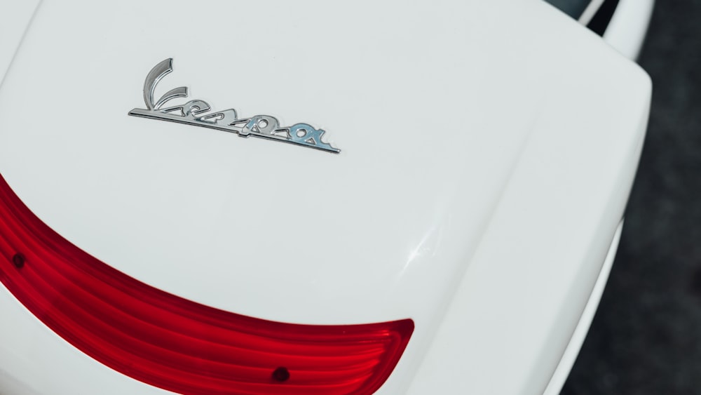 a close up of the tail end of a white car