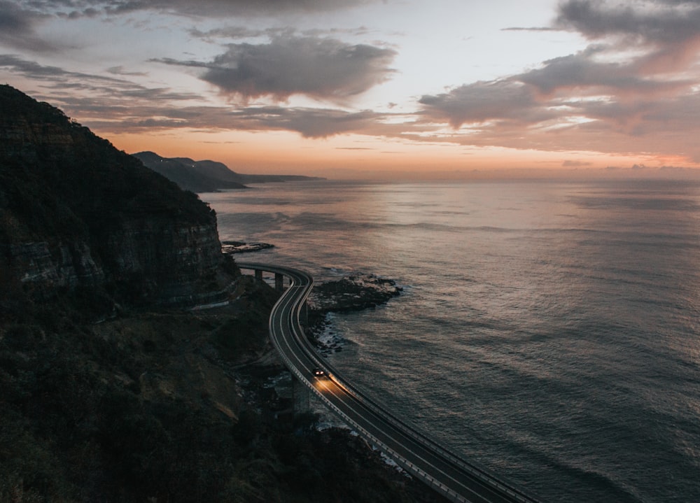 road beside body of water