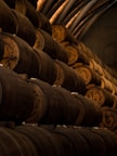 low light photography of pile of barrels