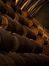 low light photography of pile of barrels