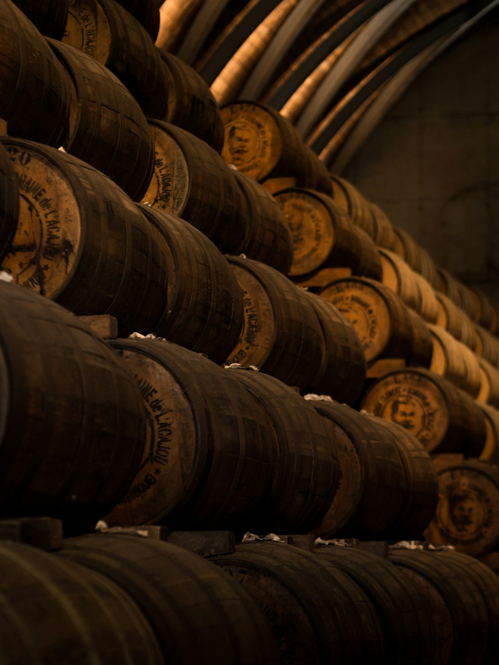 low light photography of pile of barrels