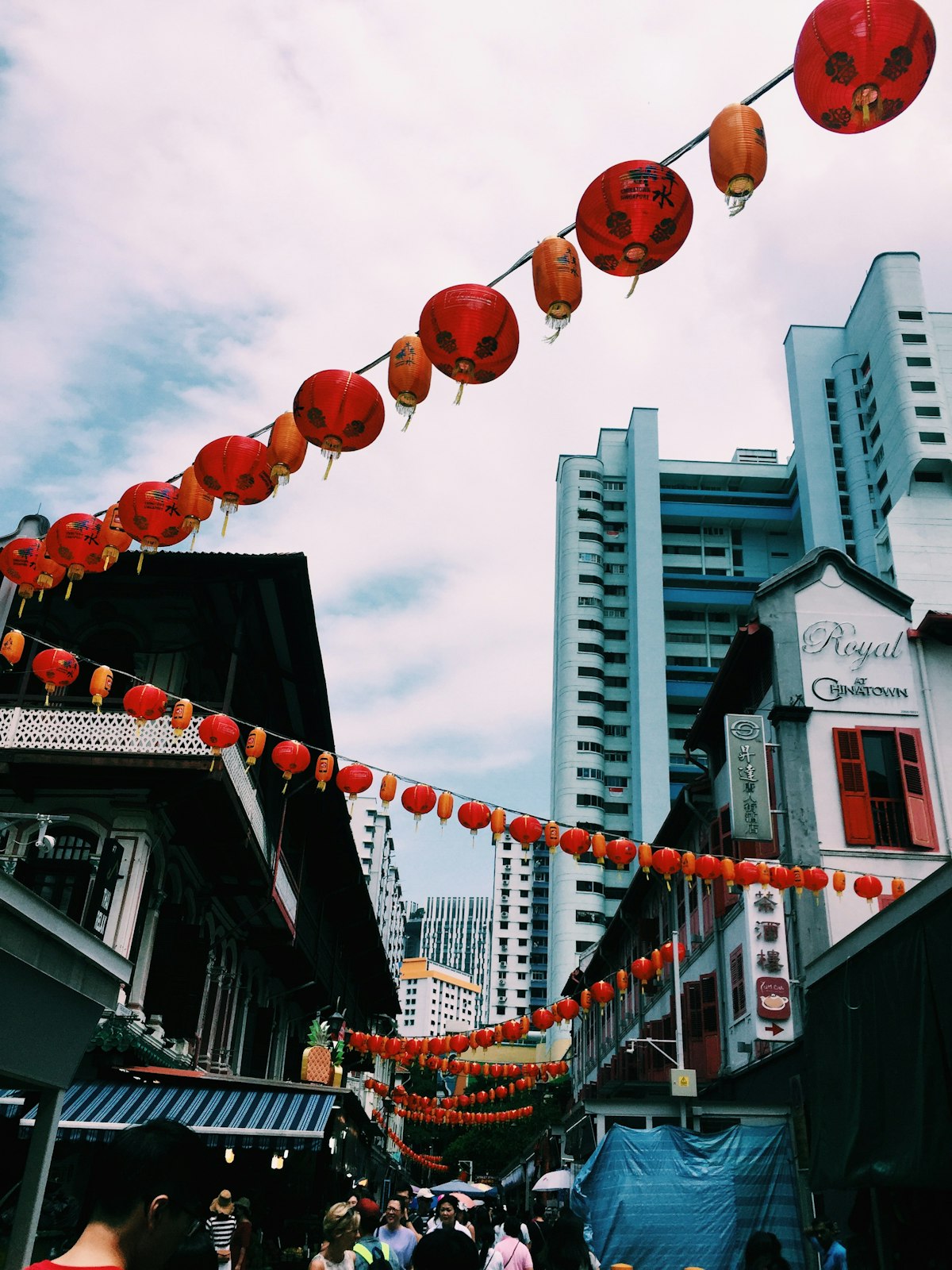 Singapore January — Chinatown alleyway hung with red and orange lanterns for the festive season