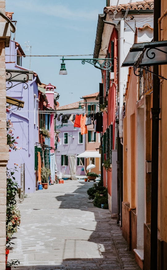 clothes on hanging wire in between buildings in Burano Italy