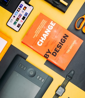 Change by Design by Tim Brown book beside smartphone