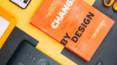 Change by Design by Tim Brown book beside smartphone